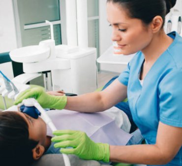 dental hygienist with a patient