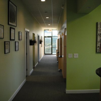 Hallway with pictures on the wall and operatories